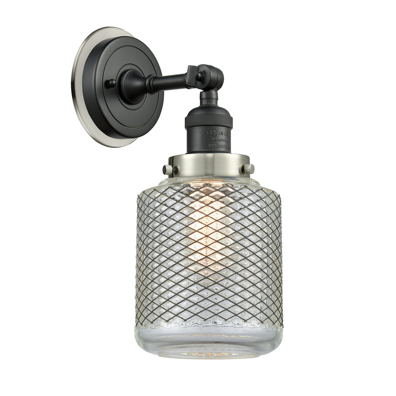 Stanton Sconce shown in the Matte Black finish with a Clear Wire Mesh shade