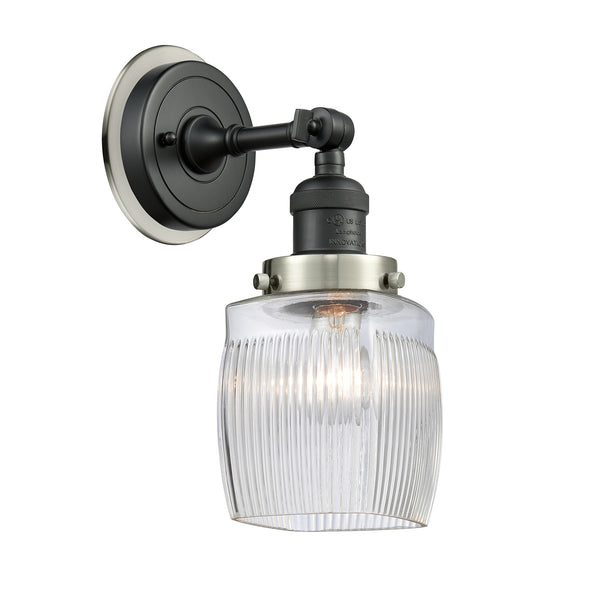 Colton Sconce shown in the Matte Black finish with a Clear Halophane shade