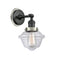 Oxford Sconce shown in the Matte Black finish with a Clear shade