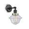 Oxford Sconce shown in the Matte Black finish with a Seedy shade
