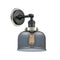 Bell Sconce shown in the Matte Black finish with a Plated Smoke shade