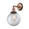 Beacon Sconce shown in the Antique Copper finish with a Clear shade