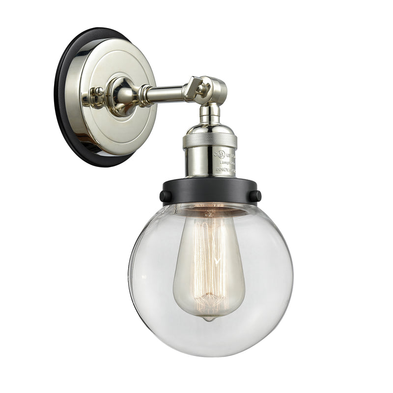 Beacon Sconce shown in the Polished Nickel finish with a Clear shade