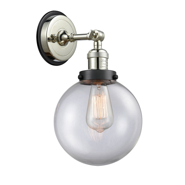 Beacon Sconce shown in the Polished Nickel finish with a Clear shade