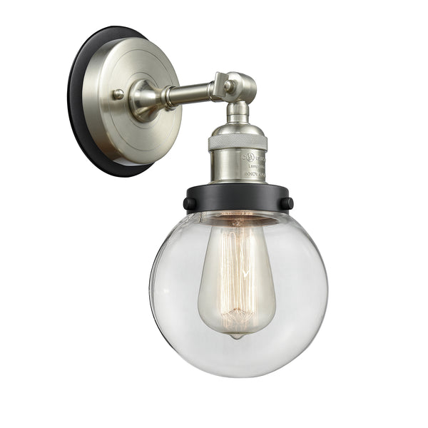 Beacon Sconce shown in the Brushed Satin Nickel finish with a Clear shade