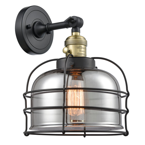 Bell Cage Sconce shown in the Black Antique Brass finish with a Plated Smoke shade