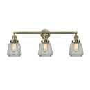 Chatham Bath Vanity Light shown in the Antique Brass finish with a Clear shade