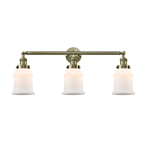 Canton Bath Vanity Light shown in the Antique Brass finish with a Matte White shade