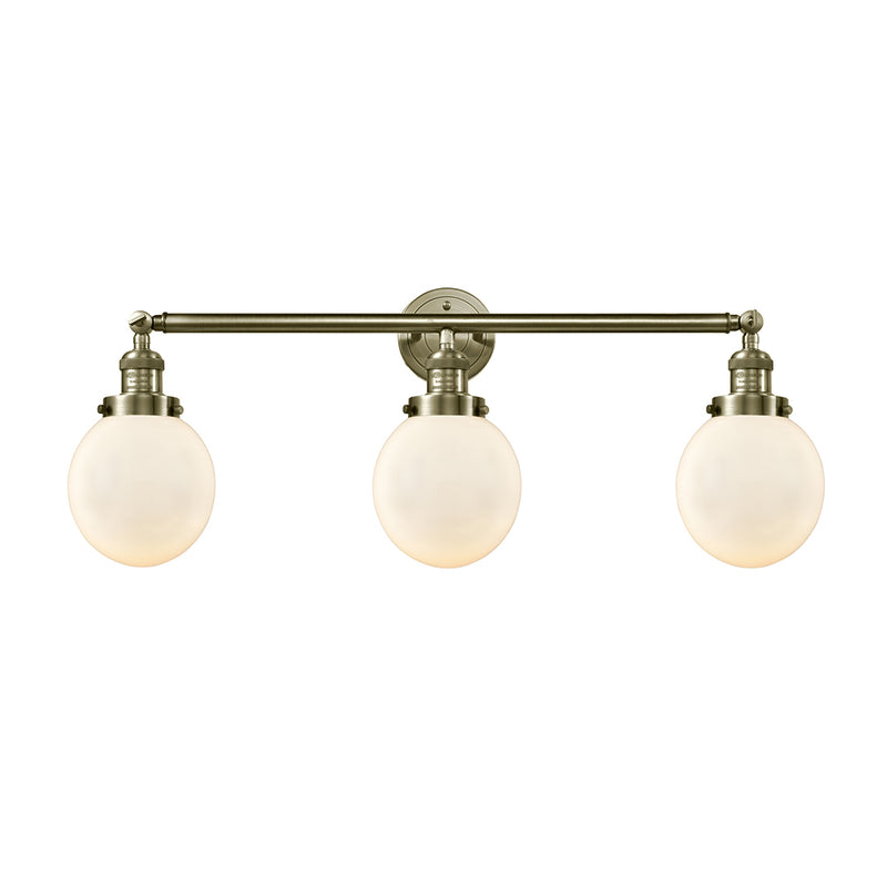 Beacon Bath Vanity Light shown in the Antique Brass finish with a Matte White shade