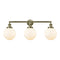 Beacon Bath Vanity Light shown in the Antique Brass finish with a Matte White shade