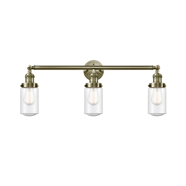 Dover Bath Vanity Light shown in the Antique Brass finish with a Seedy shade