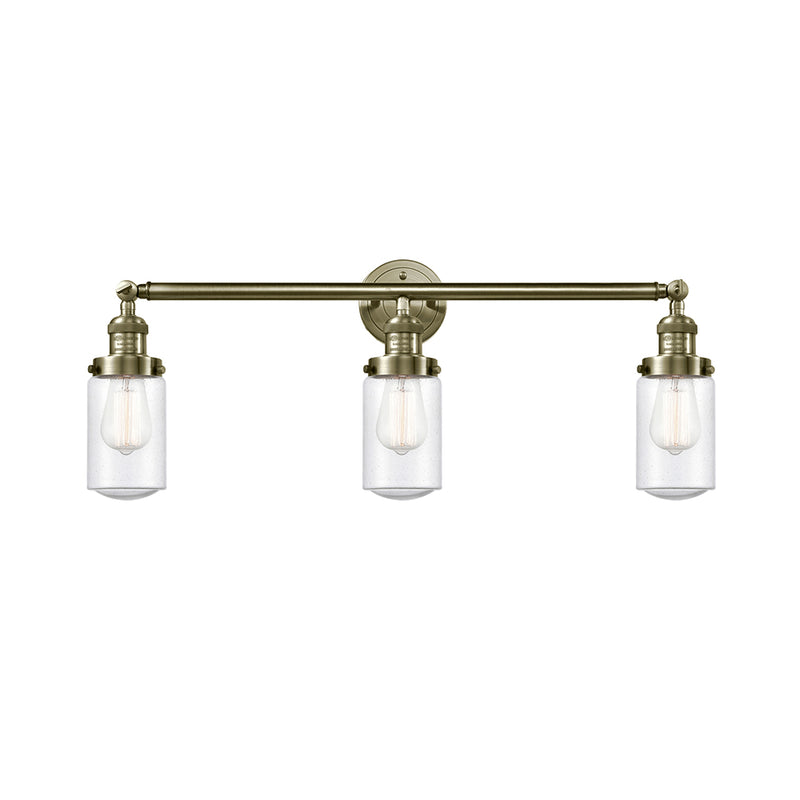 Dover Bath Vanity Light shown in the Antique Brass finish with a Seedy shade