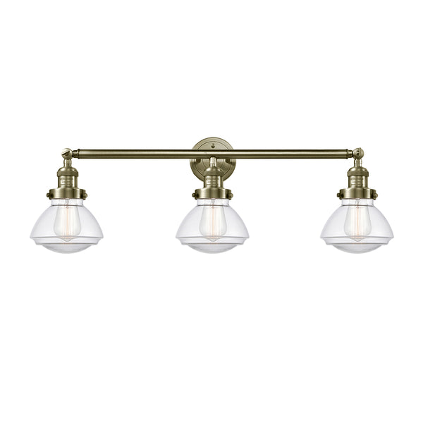Olean Bath Vanity Light shown in the Antique Brass finish with a Clear shade