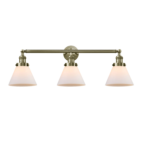 Cone Bath Vanity Light shown in the Antique Brass finish with a Matte White shade