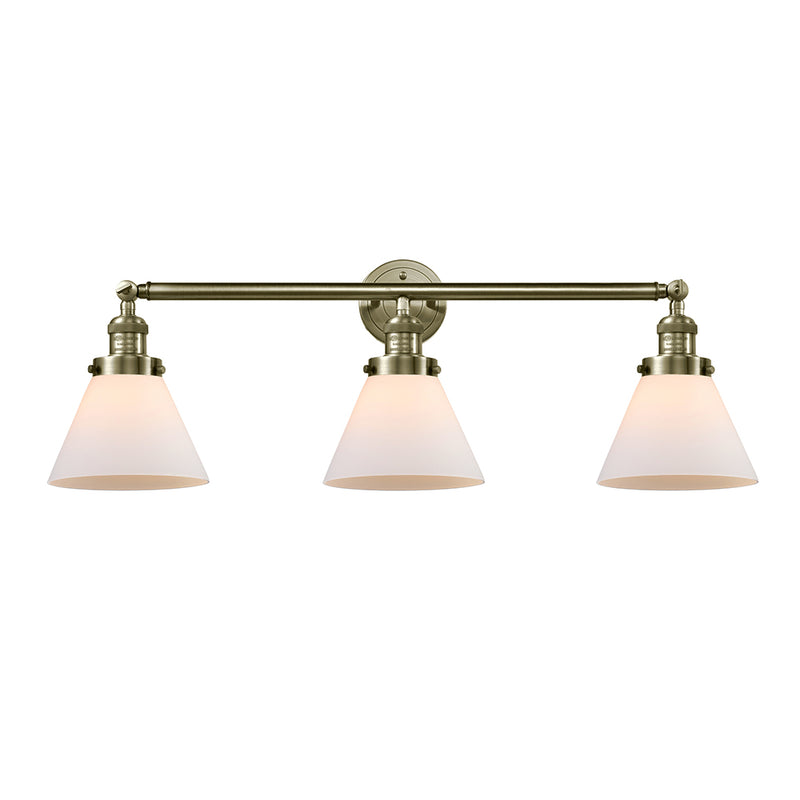 Cone Bath Vanity Light shown in the Antique Brass finish with a Matte White shade