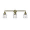 Bell Bath Vanity Light shown in the Antique Brass finish with a Clear shade