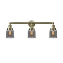 Bell Bath Vanity Light shown in the Antique Brass finish with a Plated Smoke shade