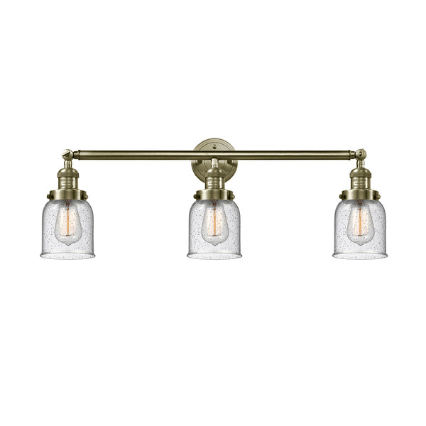 Bell Bath Vanity Light shown in the Antique Brass finish with a Seedy shade