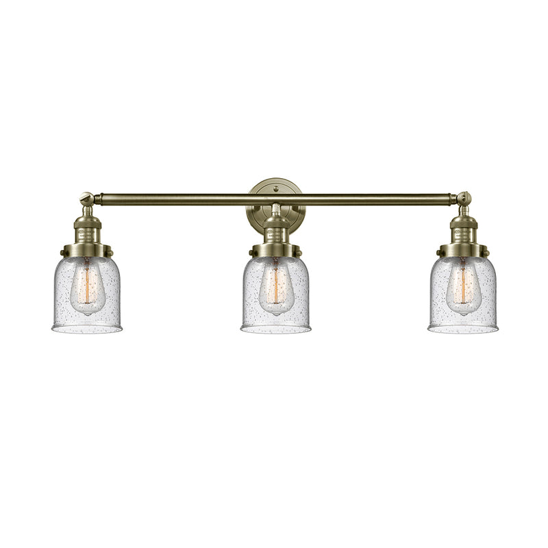 Bell Bath Vanity Light shown in the Antique Brass finish with a Seedy shade