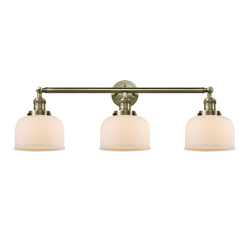 Bell Bath Vanity Light shown in the Antique Brass finish with a Matte White shade