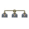 Bell Bath Vanity Light shown in the Antique Brass finish with a Plated Smoke shade