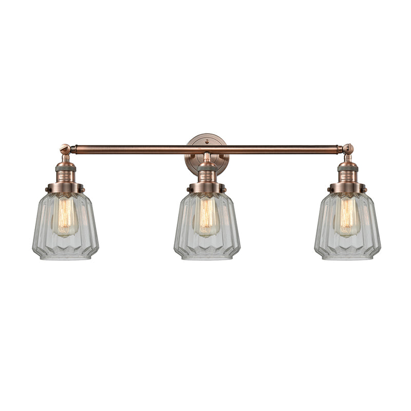 Chatham Bath Vanity Light shown in the Antique Copper finish with a Clear shade