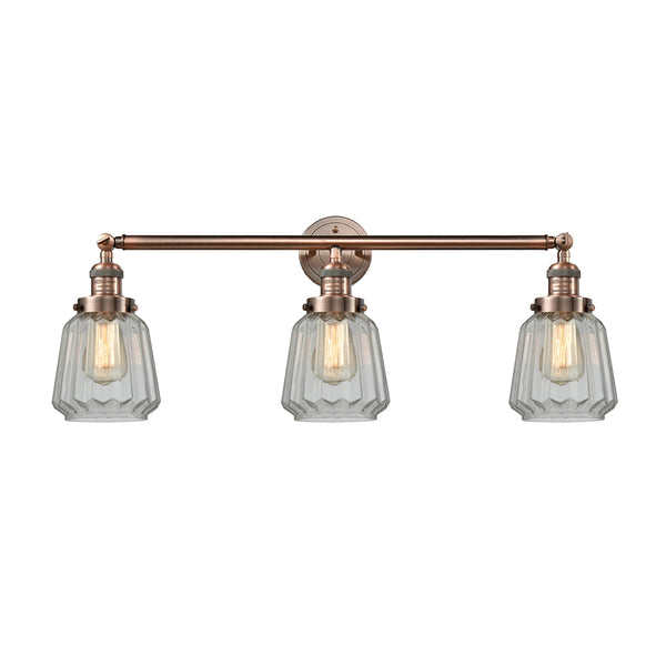 Chatham Bath Vanity Light shown in the Antique Copper finish with a Clear shade