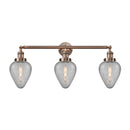 Geneseo Bath Vanity Light shown in the Antique Copper finish with a Clear Crackled shade