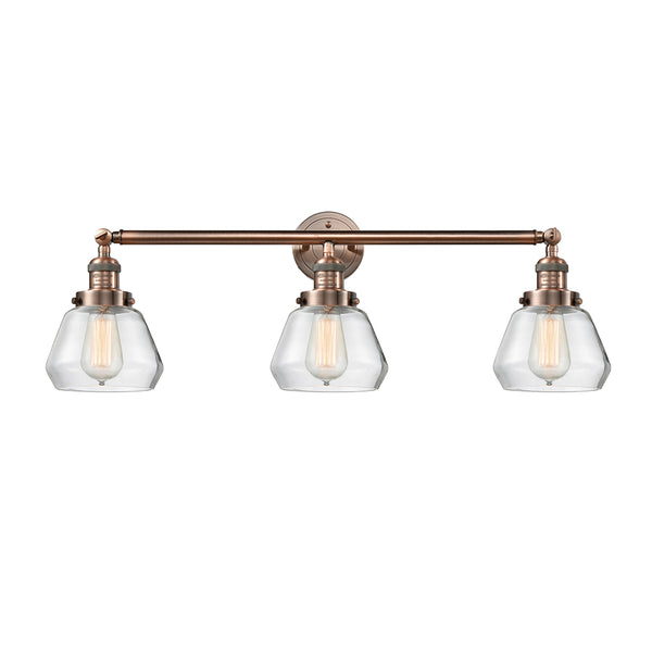 Fulton Bath Vanity Light shown in the Antique Copper finish with a Clear shade