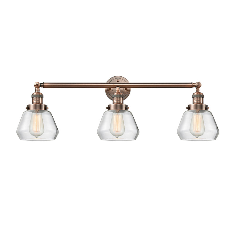 Fulton Bath Vanity Light shown in the Antique Copper finish with a Clear shade
