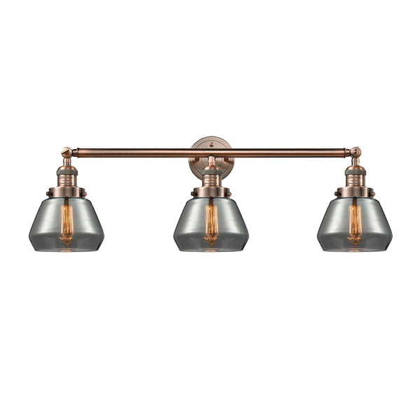Fulton Bath Vanity Light shown in the Antique Copper finish with a Plated Smoke shade