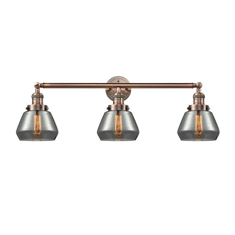 Fulton Bath Vanity Light shown in the Antique Copper finish with a Plated Smoke shade