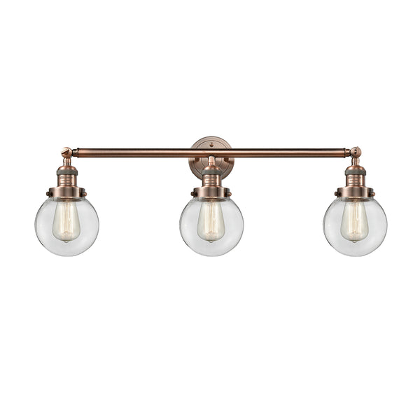 Beacon Bath Vanity Light shown in the Antique Copper finish with a Clear shade