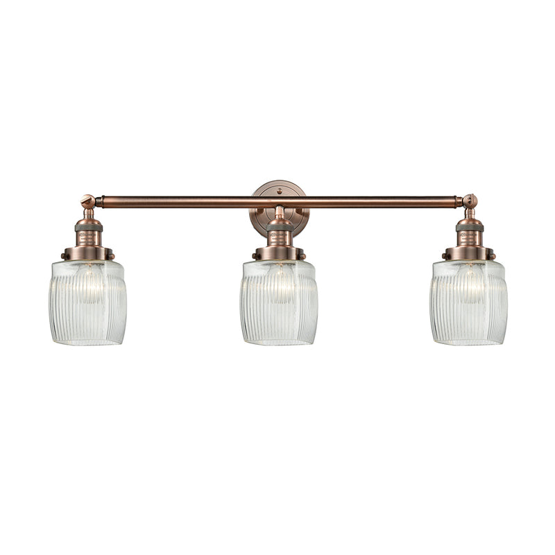 Colton Bath Vanity Light shown in the Antique Copper finish with a Clear Halophane shade