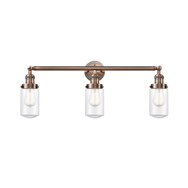 Dover Bath Vanity Light shown in the Antique Copper finish with a Clear shade