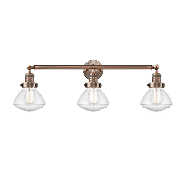 Olean Bath Vanity Light shown in the Antique Copper finish with a Seedy shade