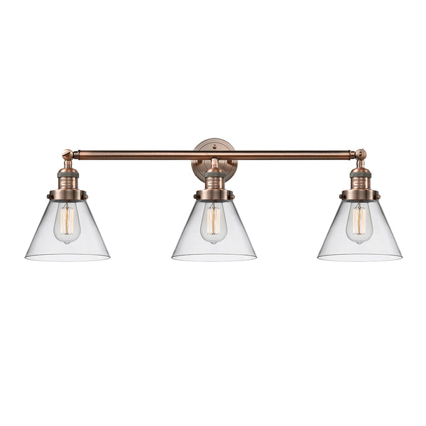Cone Bath Vanity Light shown in the Antique Copper finish with a Clear shade