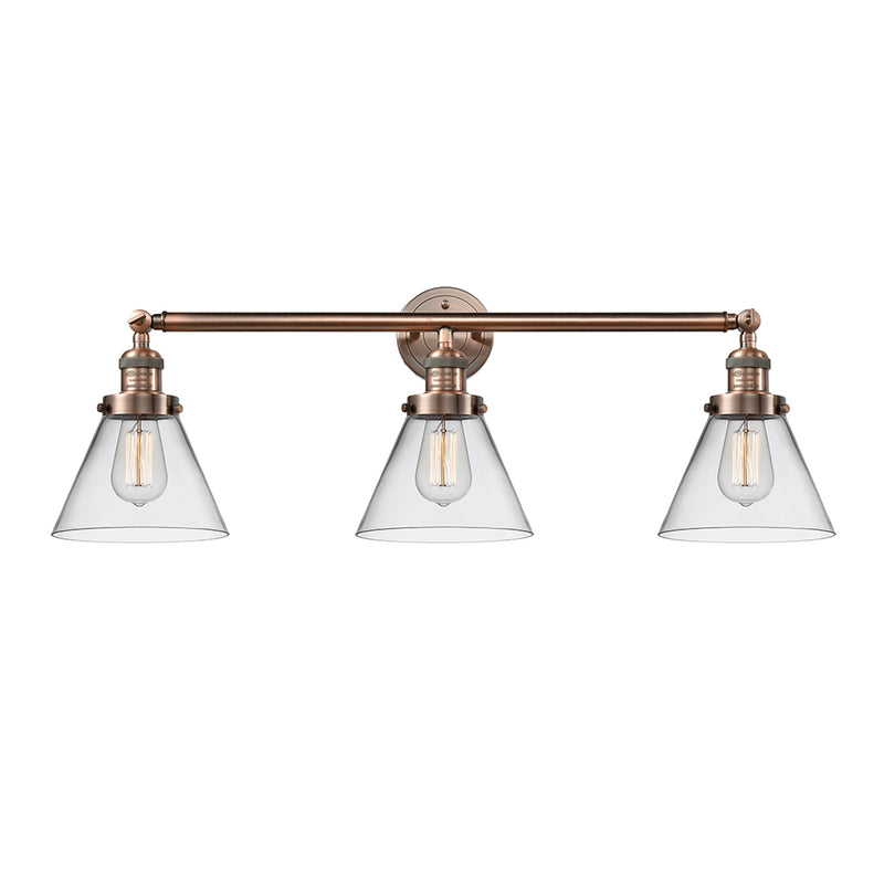 Cone Bath Vanity Light shown in the Antique Copper finish with a Clear shade