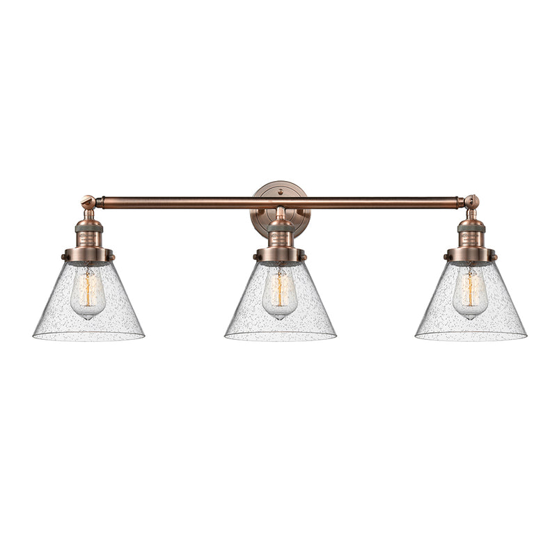 Cone Bath Vanity Light shown in the Antique Copper finish with a Seedy shade