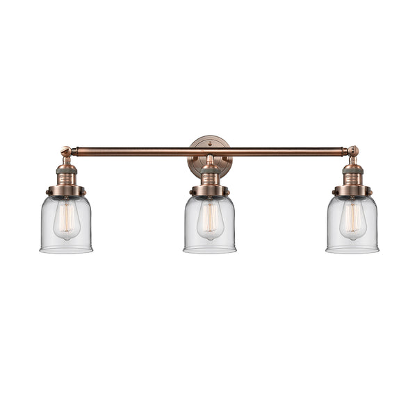 Bell Bath Vanity Light shown in the Antique Copper finish with a Clear shade