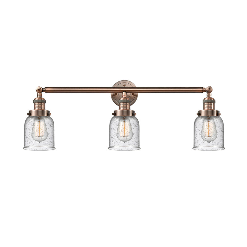 Bell Bath Vanity Light shown in the Antique Copper finish with a Seedy shade