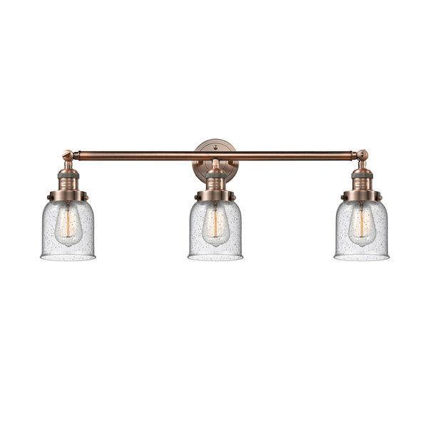 Bell Bath Vanity Light shown in the Antique Copper finish with a Seedy shade