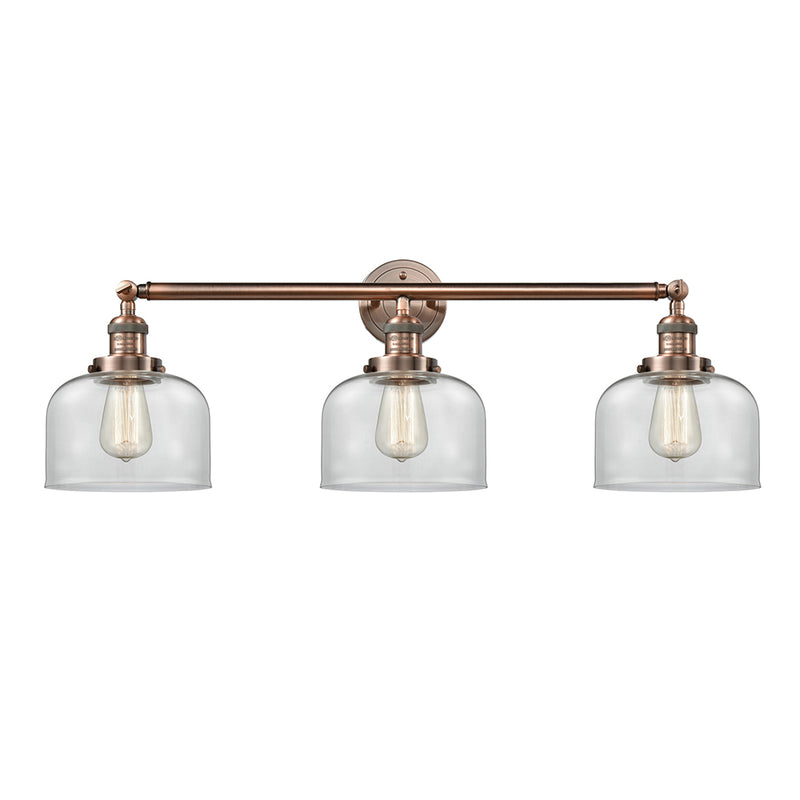 Bell Bath Vanity Light shown in the Antique Copper finish with a Clear shade