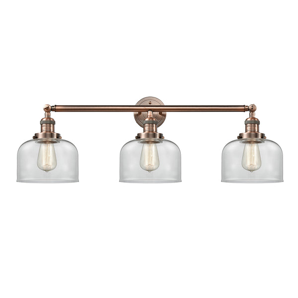 Bell Bath Vanity Light shown in the Antique Copper finish with a Clear shade