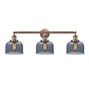 Bell Bath Vanity Light shown in the Antique Copper finish with a Plated Smoke shade