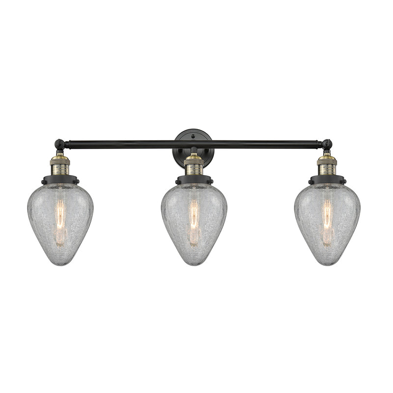 Geneseo Bath Vanity Light shown in the Black Antique Brass finish with a Clear Crackled shade