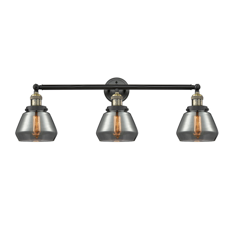 Fulton Bath Vanity Light shown in the Black Antique Brass finish with a Plated Smoke shade