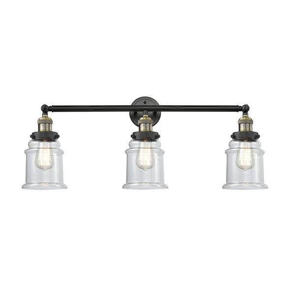 Canton Bath Vanity Light shown in the Black Antique Brass finish with a Clear shade