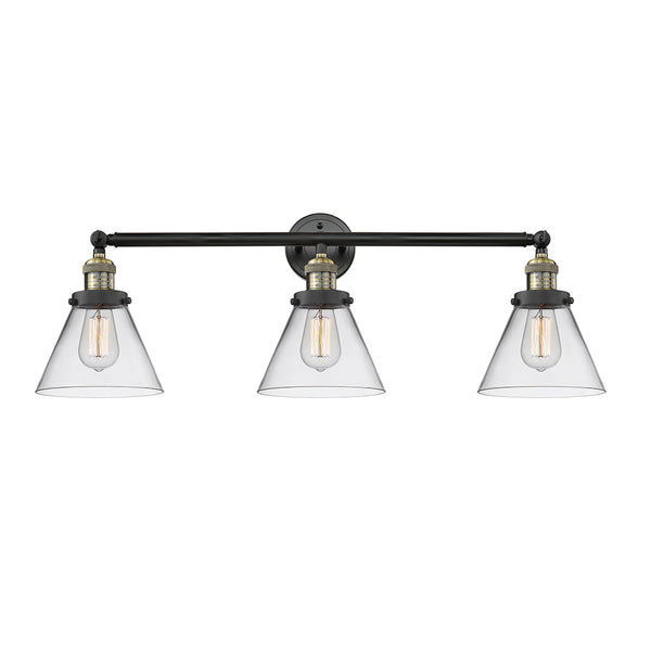 Cone Bath Vanity Light shown in the Black Antique Brass finish with a Clear shade