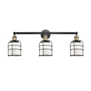 Bell Cage Bath Vanity Light shown in the Black Antique Brass finish with a Matte White shade